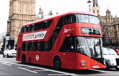 red bus on road near big ben in london